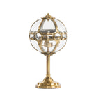 Lámpara de mesa con esfera de cristal y acabado latón Rutilo