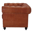 Sillón capitoné de piel Yolanda